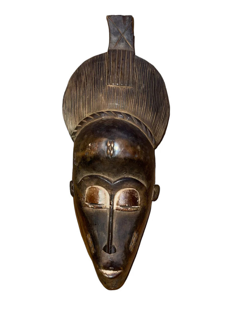 An elongated Baule Mask (Baoulé Mask)