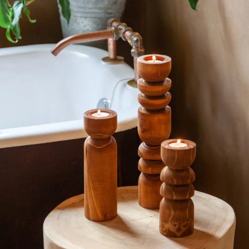 Set of 3 pillar candle holders, carved in natural wood