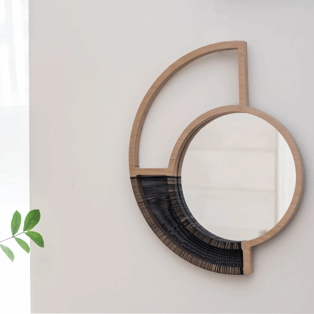 Distinctive asymetric mirror in light wood adorned with black cord