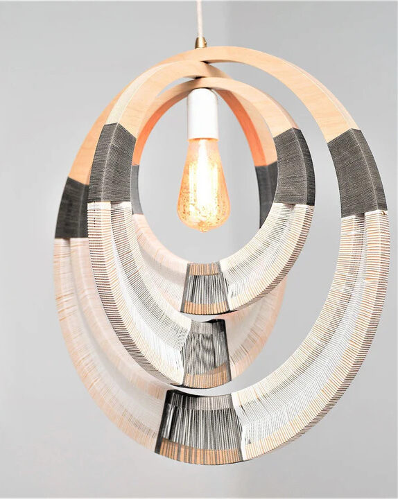 A white and grey pendant ceiling lamp made out of woven hoops