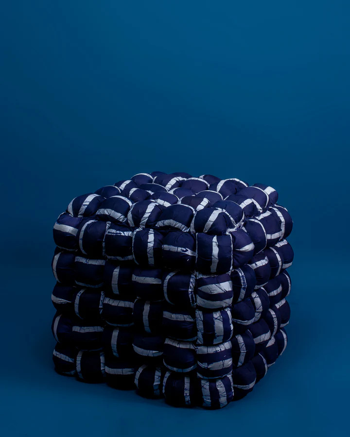 A deep-blue pouffe