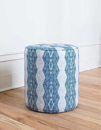 African living room furniture: A white pouffe with indigo blue African pattern