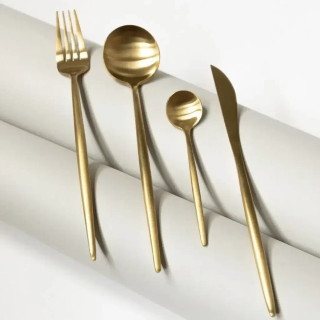 Two golden spoons, a golden fork and a golden knife