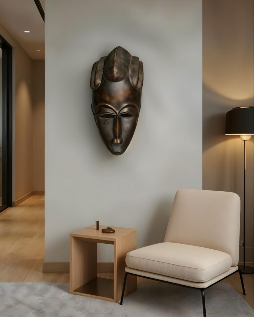 Modern home vignette with a gorgeous African Baule mask on the wall