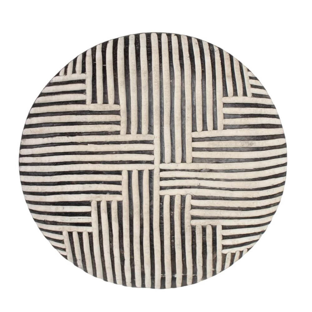 Dark wood Bamileke shield with white carved geometric motifs including straight lines and stair-shape lines