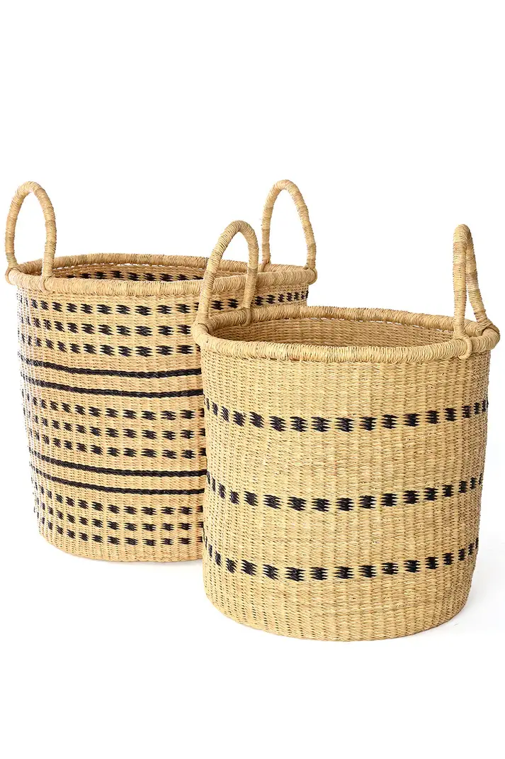 A chic set of two natural hamper baskets with decorative navy horizontal stripes