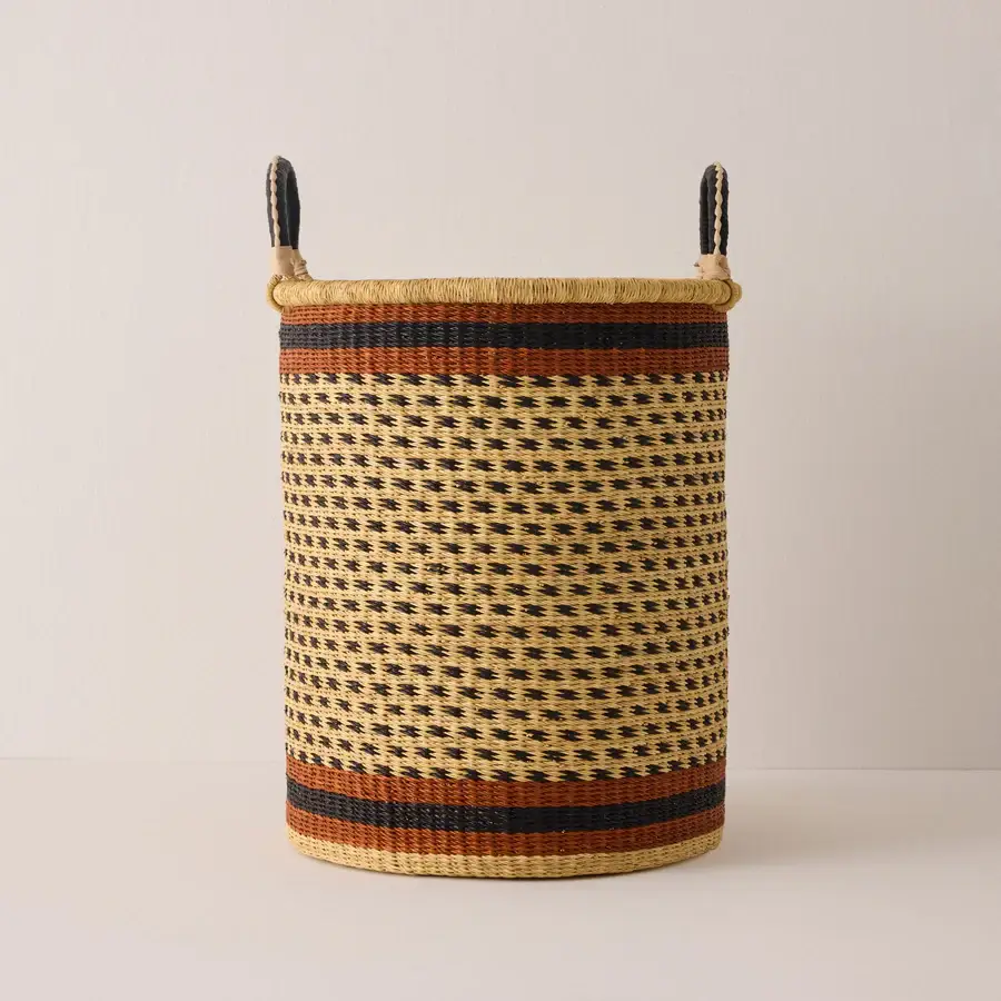 Gorgeous tall woven storage african basket, with navy andrust stripes at the top and at the bottom of the piece