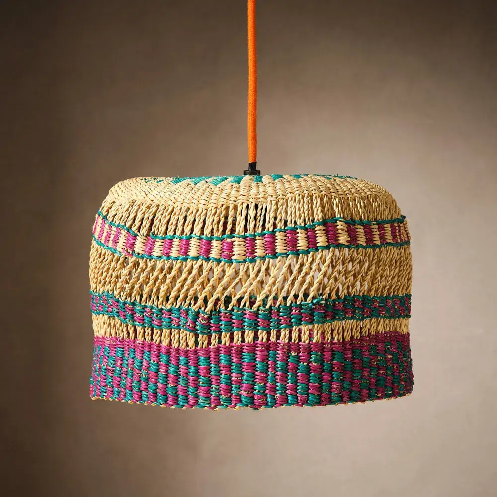 Woven pendant lampshade from Ghana with natural grass and fushian and teal accents