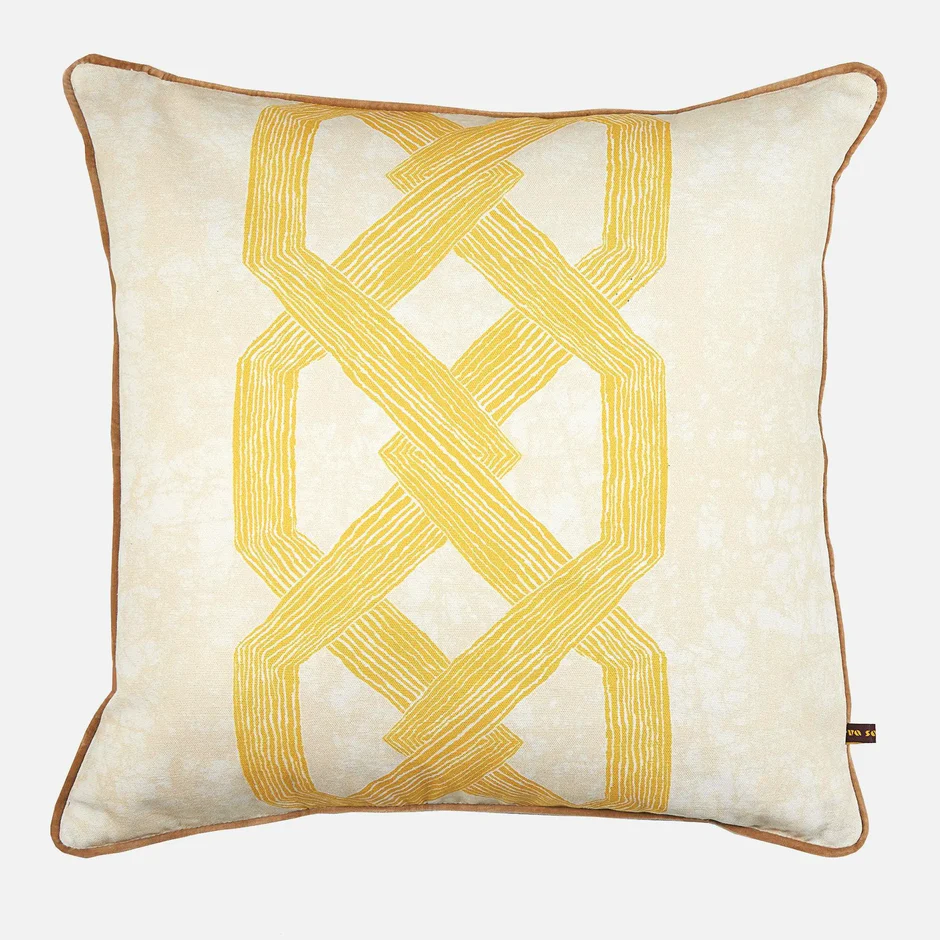 Light yellow throw pillow with bright yellow geometric pattern