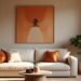 A bright and aesthetically pleasing African living room scene showcasing a simple living room wall design with an eye-catching piece of artwork and a decor shelf.