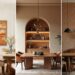 Dining room wall design done 3 ways: narrow wall with a large horizontal earthy paintings, tall wall with a stunning built-in arch and medium wall with African-inspired wallpaper