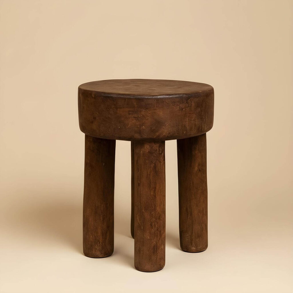 Vintage Lobi stool on a light earthy studio background
