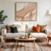 Small apartment interior decor in a cozy living room with a white sofa, orange armchairs, and a round wooden table. Abstract art and indoor plants add warmth and a modern touch.