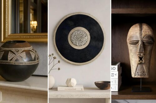 African home decor showpieces: a zulu pot on a mantle, a textured beaded shield with concentric circles, and a Songye mask on a shelf. Earthy tones convey a cultural and artistic vibe.