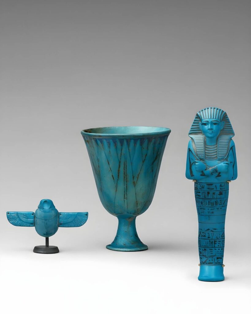 Three ancient Egyptian faience artifacts in turquoise color: a falcon figurine, a lotus-shaped chalice, and a statuette of a pharaoh, all intricately detailed.