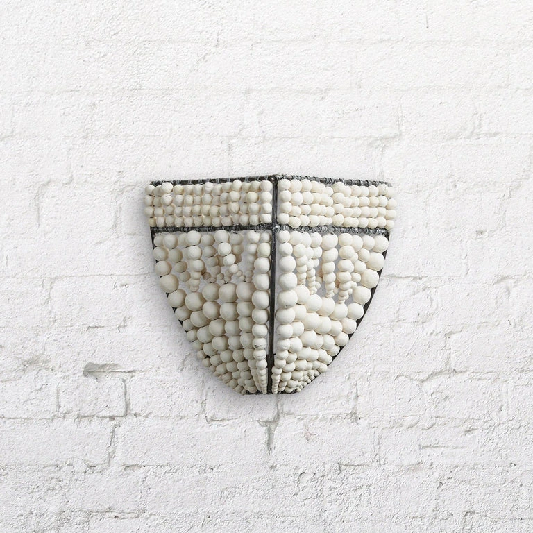 Beaded clay wall sconce
