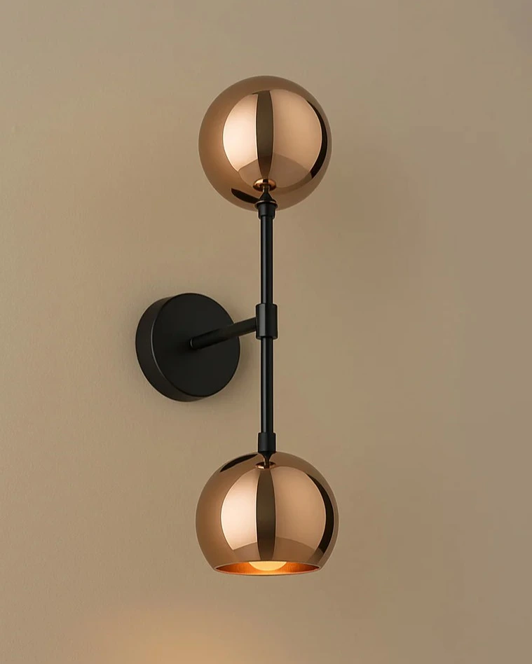 Double globe brass sconce