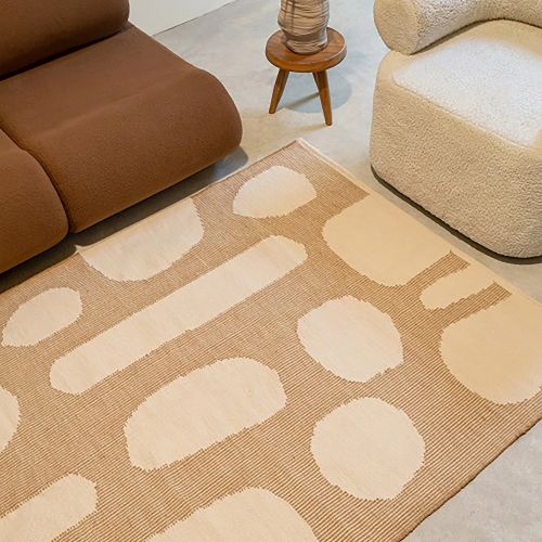 Sand beige wool rug in a modern living room