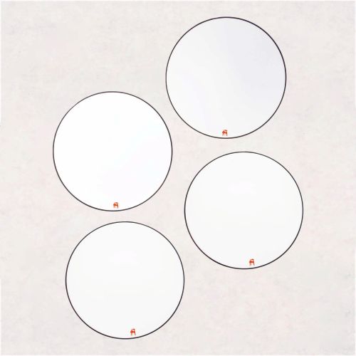 fine limoges porcelain dining plate set of four with a small, orange gazelle symbol is located on the bottom of each round plate
