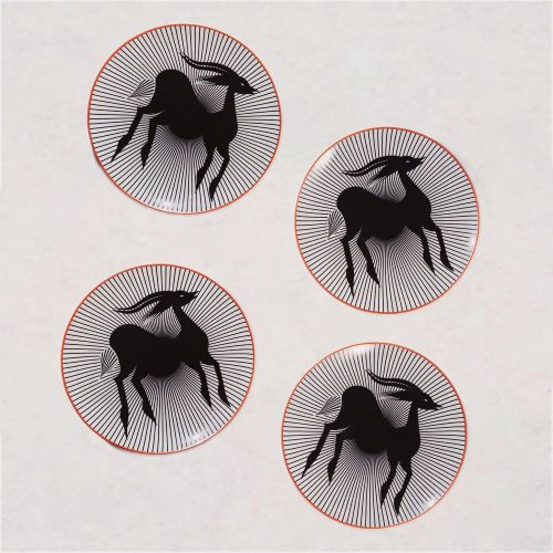Set of four porcelain appetizer plates with orange edges and a stunning gazelle design in the middle