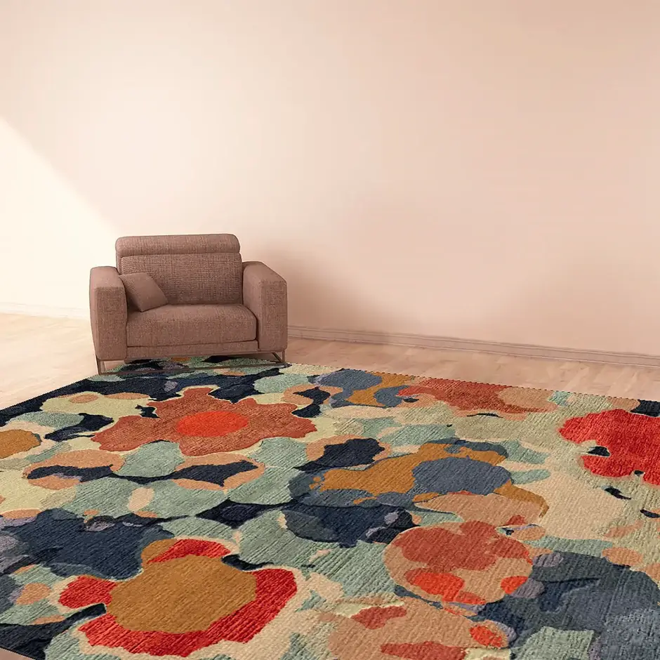 A super colorful maximalist oversize bamboo silk rug on the floor, with a brown armchair in the corner of the room