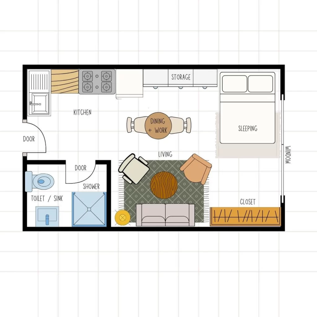Studio floor plan prioritizing the living area, which features a sofa, two accent chairs, and a large patterned rug. The layout includes a kitchen, a combined dining and work table, a sleeping area, and a closet positioned near the window.