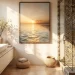 A serene, sun-drenched bathroom featuring a large-scale sunset photograph as bathroom art centered on the wall, next to a walk-in shower with decorative floral tiling and a modern white vanity.