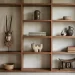A wooden bookshelf with open square compartments displays a heritage collection: African masks, woven baskets, stacked books, pottery, and decorative artifacts. Natural light streams in from a nearby window.